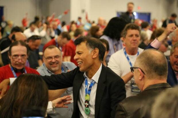 Hassan Yussuff, centre, is retiring as president of the Canadian Labour Congress. (Hassan Yussuff/Facebook - image credit)