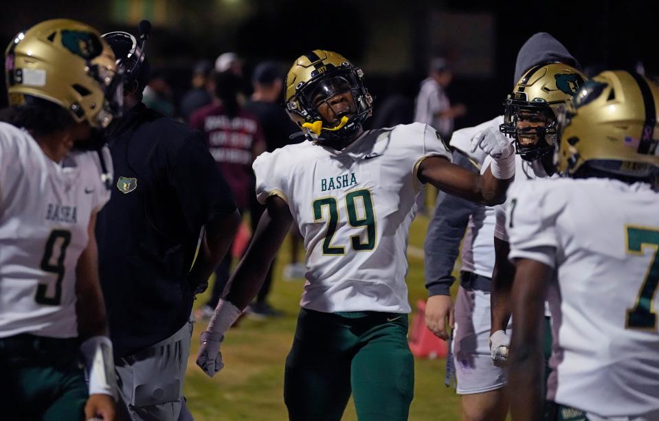 Basha running back Noah Roberts (29) celebrates a touchdown on the first play of the game against Hamilton during a game at Hamilton High School in Chandler on Oct. 6, 2023.