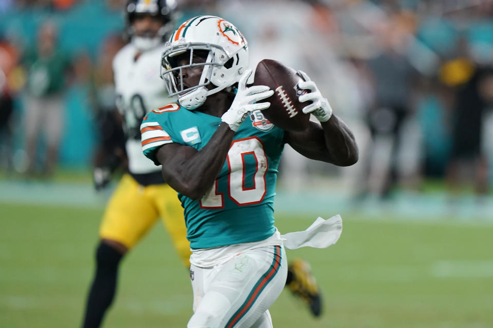 Miami Dolphins wide receiver Tyreek Hill (10) grabs a pass during the second half of an NFL football game against the Pittsburgh Steelers, Sunday, Oct. 23, 2022, in Miami Gardens, Fla. (AP Photo/Wilfredo Lee )
