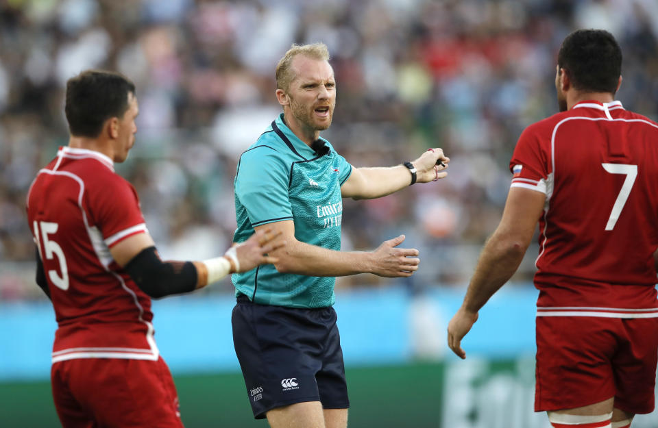Referee Wayne Barnes gestures to players during the Rugby World Cup Pool A game at Shizuoka Stadium Ecopa between Scotland and Russia in Shizuoka, Japan, Wednesday, Oct. 9, 2019. (AP Photo/Christophe Ena)