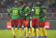 Cameroon's Karl Toko-Ekambi, middle, celebrates with teammates after scoring his side's first goal during the African Cup of Nations 2022 round of 16 soccer match between Cameroon and Comoros at the Olembe stadium in Yaounde, Cameroon, Monday, Jan. 24, 2022. (AP Photo/Themba Hadebe)