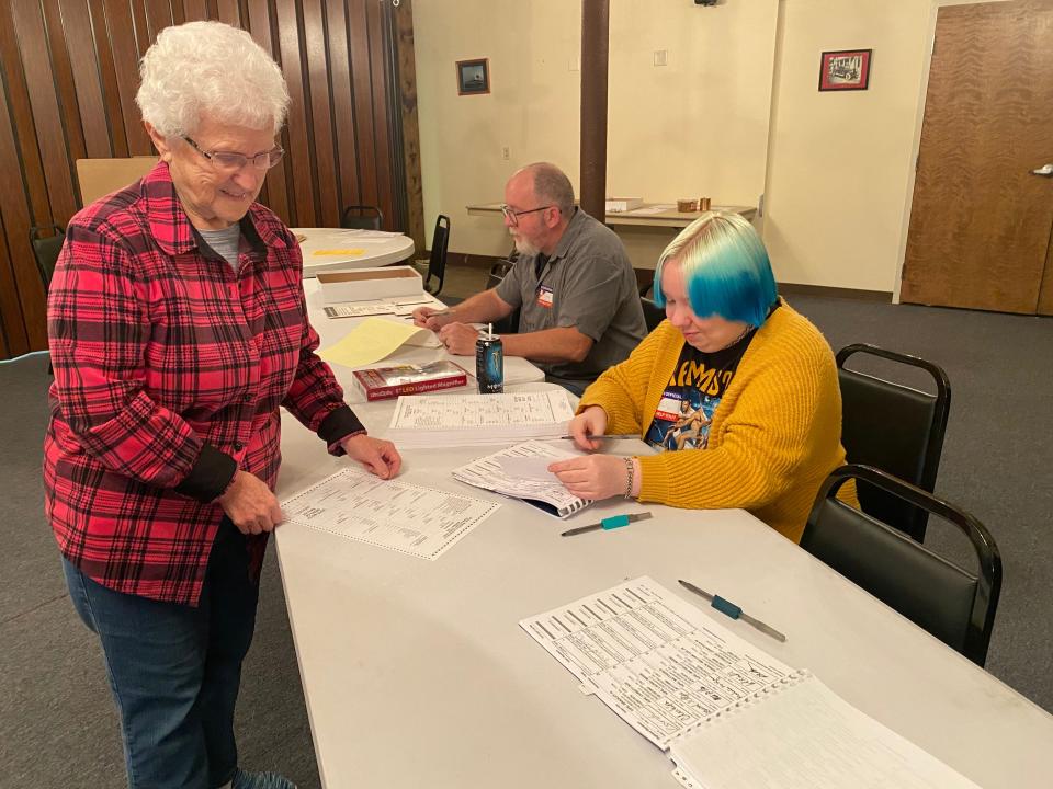 Jean Pine of Mercersburg, pictured with clerks Claude Zimmerman and Molly Ford, was one of the first voters at the MMP&W Activity Center for the Nov. 7 election.