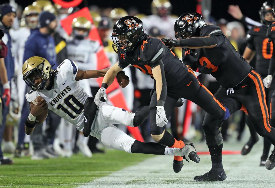 Hoban QB Tylan Boykin (10) is knocked out of bounds by Massillon defensive back Tyler Hackenbracht in the 2023 OHSAA Division II state finals.