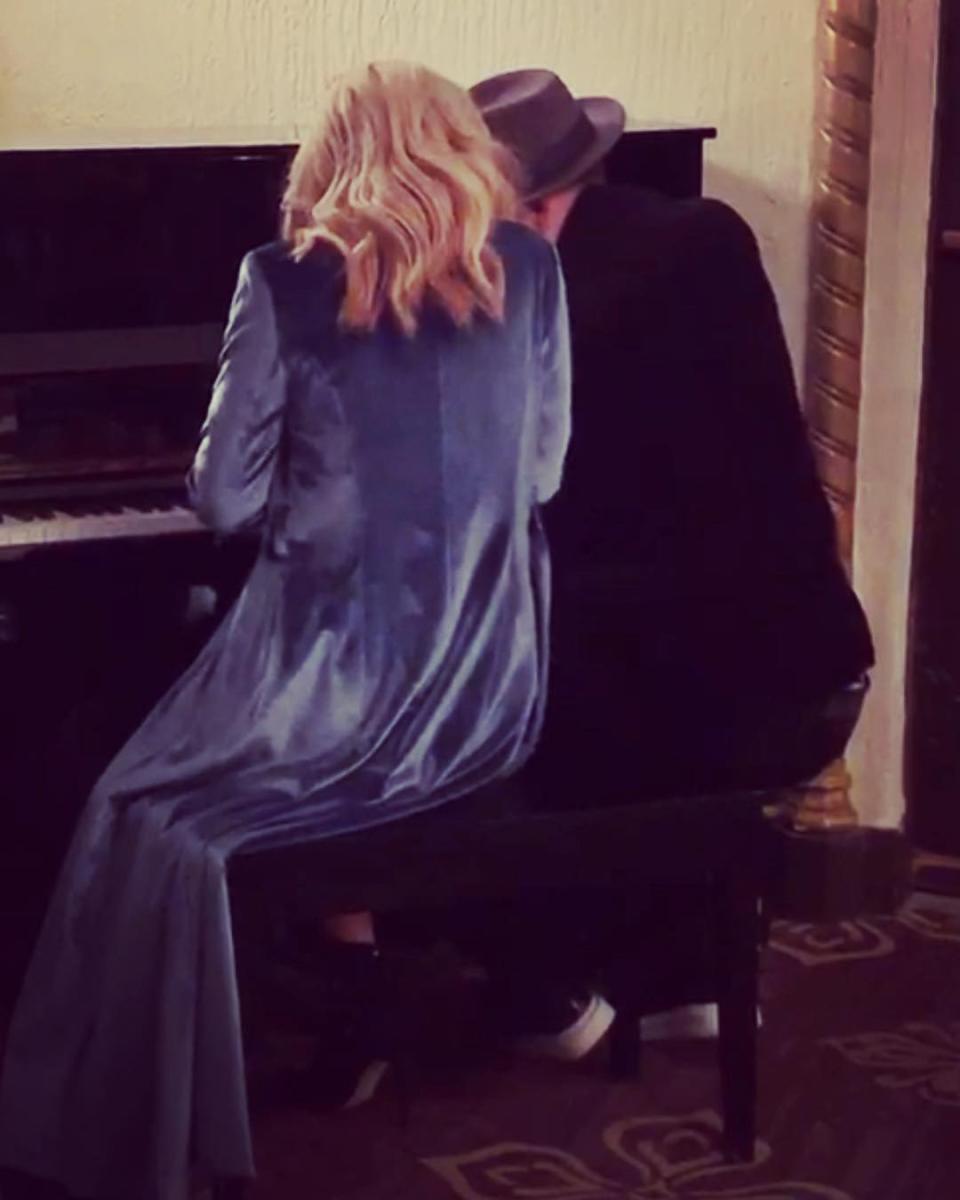 "The couple that plays together stays together," Wahlberg captioned this photo of him playing the piano with his wife. 