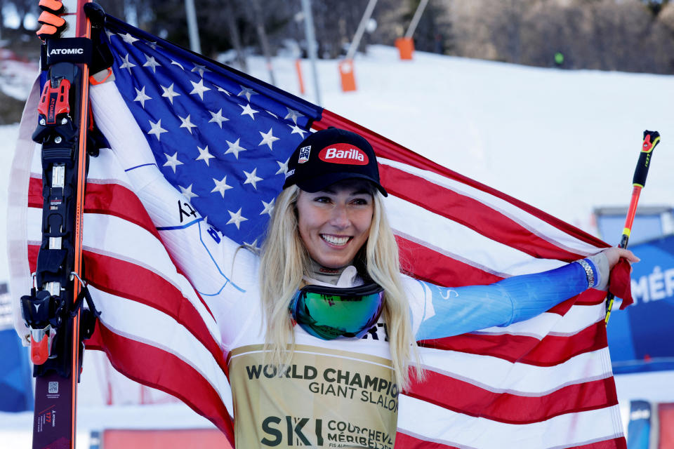 Alpine Skiing - FIS Alpine Ski World Cup - Women's Giant Slalom - Meribel, France - February 16, 2023 Mikaela Shiffrin of the U.S. poses with the United States flag after winning the Women's Giant Slalom REUTERS/Leonhard Foeger     TPX IMAGES OF THE DAY