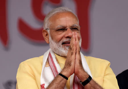 Indian Prime Minister Narendra Modi greets his supporters during the celebration marking the National Democratic Alliance (NDA) government's three years in power at the Khanapara Veterinary ground in Guwahati, India, May 26, 2017. REUTERS/Anuwar Hazarika