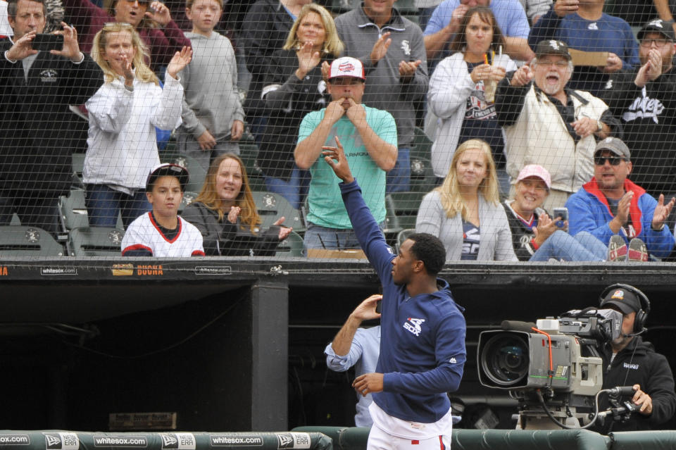 Chicago White Sox's Tim Anderson (7) comes out of the dugout and waves to fans after a baseball game against the Detroit Tigers Sunday, Sept. 29, 2019, in Chicago. Anderson, who is attempting to become the third White Sox player to win a batting title, went 0 for 2 with two walks in the second game after sitting out the opener. (AP Photo/Mark Black)