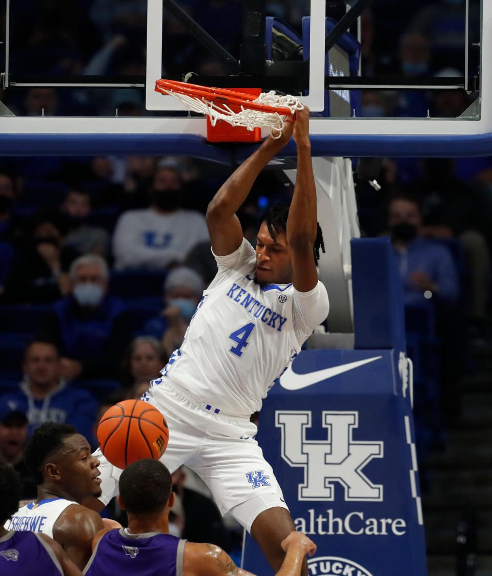 Kentucky’s Daimion Collins slams it home for two against Kentucky Wesleyan.