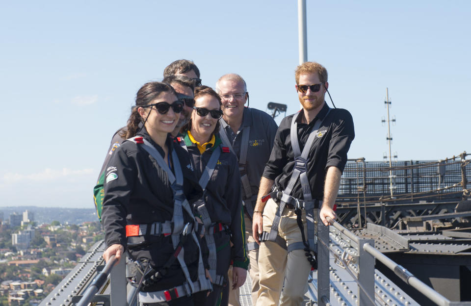 The Duke of Sussex with Australia’s Prime Minister Scott Morrison and Invictus Games representatives climb Sydney Harbour Bridge (PA)