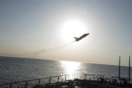 An U.S. Navy picture shows what appears to be a Russian Sukhoi SU-24 attack aircraft flying over the U.S. guided missile destroyer USS Donald Cook in the Baltic Sea in this picture taken April 12, 2016 and released April 13, 2016. REUTERS/US Navy/Handout via Reuters