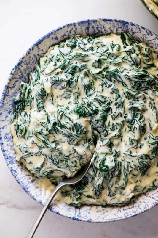 <p>Grand Baby Cakes</p><p>Easily made with spinach, smooth cream cheese, flavorful spices and a blend of decadent cheeses, this creamed spinach recipe is pure comfort food! It is an irresistible side dish that serves as the perfect accompaniment to any weeknight or holiday dinner!</p><p><strong>Get the Recipe: </strong><a href="https://grandbaby-cakes.com/creamed-spinach/" rel="nofollow noopener" target="_blank" data-ylk="slk:Creamed Spinach;elm:context_link;itc:0;sec:content-canvas" class="link rapid-noclick-resp"><strong>Creamed Spinach</strong></a></p>