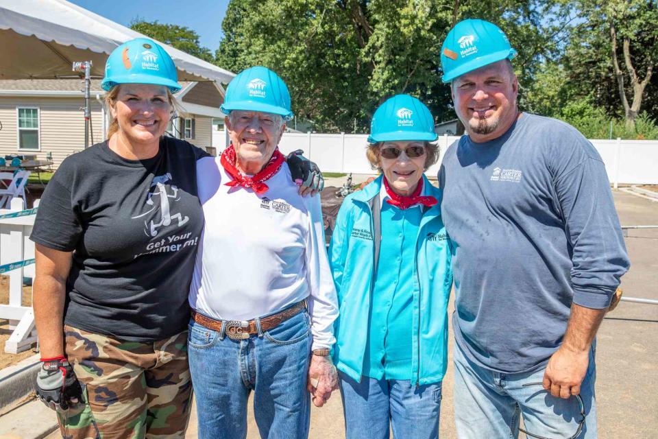 <p>Habitat for Humanity International/Jason Asteros</p> Trisha Yearwood, Jimmy Carter, Rosalynn Carter and Garth Brooks in August 2018