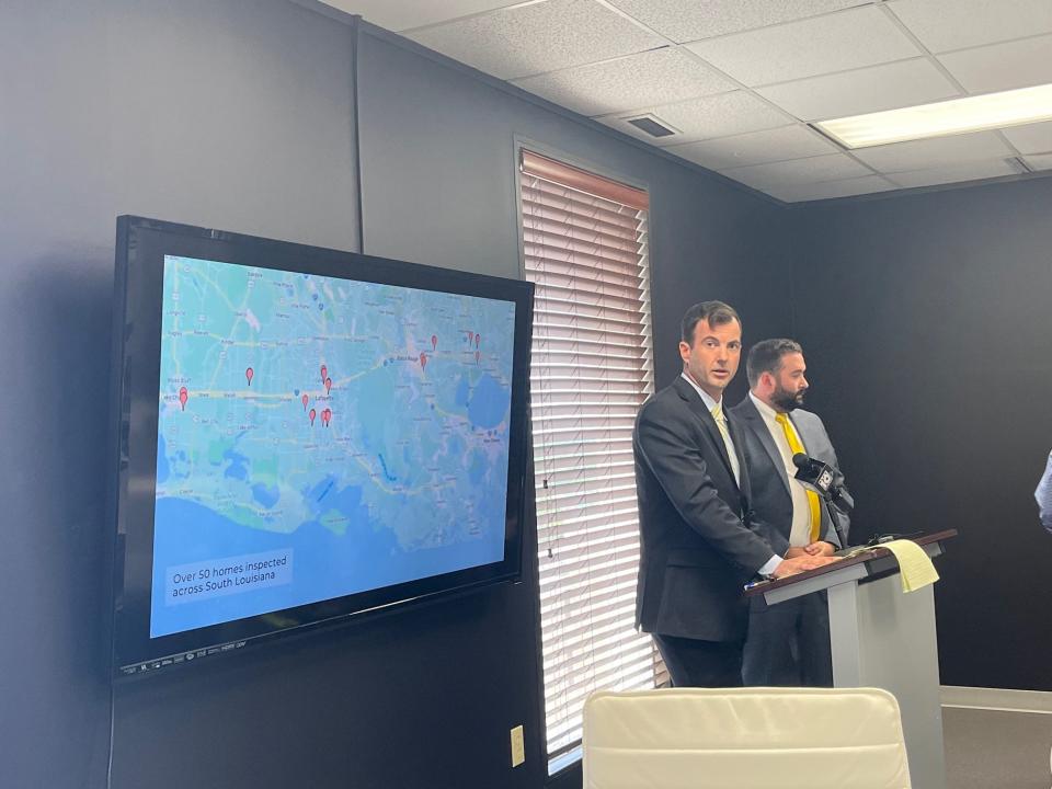 Attorneys Lance Unglesby, left, and Alan Haney talk on June 27, 2022, about the homes built by D.R. Horton that they say were not designed to accommodate for the Louisiana humidity, causing issues for homeowners.