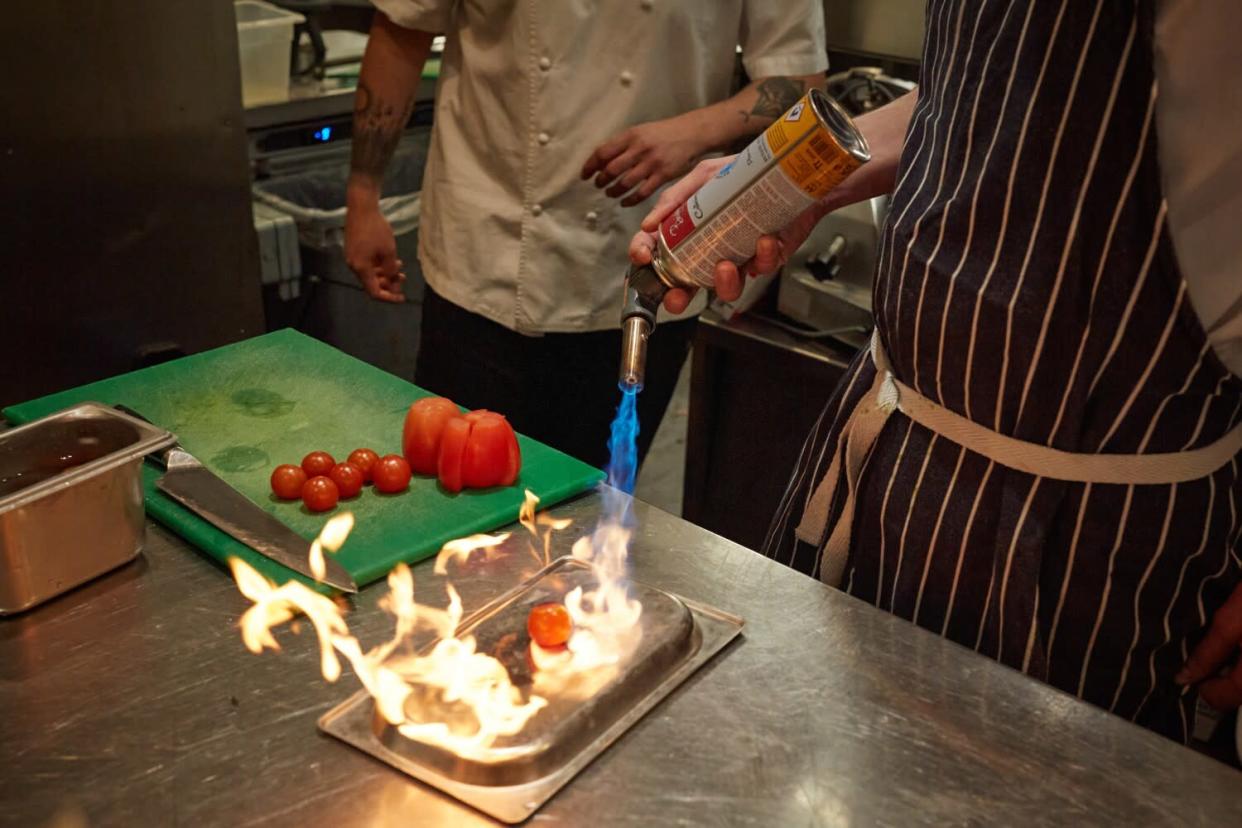 Cooks prepare dinner at SOLA.