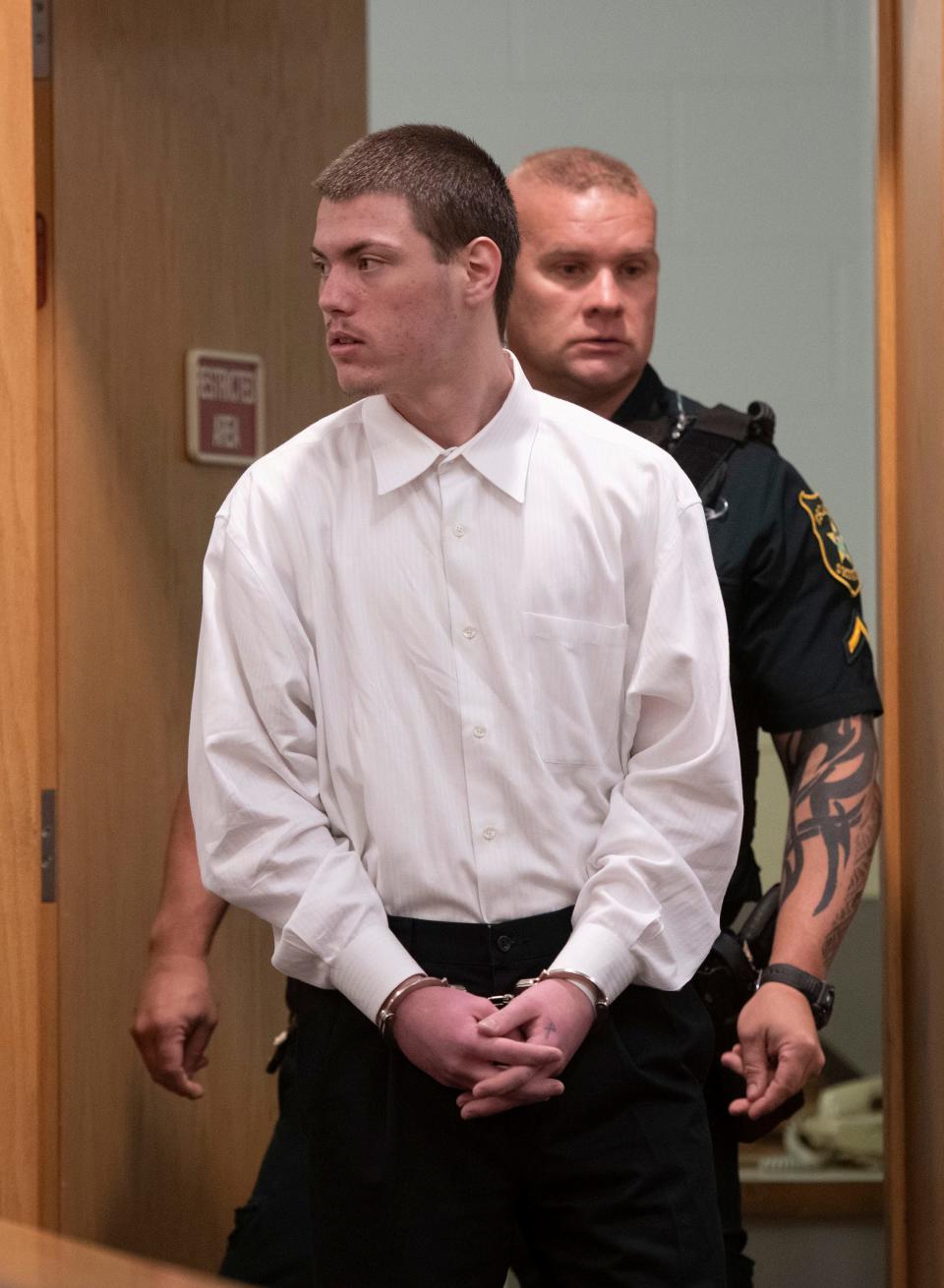 Nathan Brown enters the courtroom of Circuit Court Judge Linda Nobles on Tuesday, Aug. 1, 2023. Brown is on trial on two counts of felony murder for robbing and killing David Purchase and Natalie Greenough on Nov. 9, 2021. 