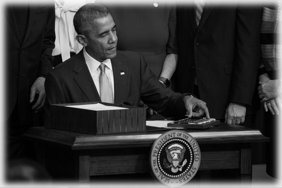 President Barack Obama signs the 21st Century Cures Act, in the South Court Auditorium of the Eisenhower Executive Office Building of the White House in Washington, D.C. on Dec. 13, 2016. The legislation eases the development and approval of experimental treatments and reforms federal policy on mental health care.  (Photo: Cheriss May/NurPhoto via Getty Images)