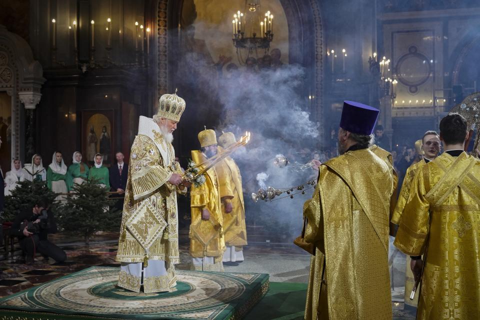 In this photo released by Russian Orthodox Church Press Service, Russian Orthodox Patriarch Kirill, center left, delivers the Christmas service in the Christ the Saviour Cathedral in Moscow, Russia, on Sunday, Jan. 7, 2024. While much of the world has Christmas in the rearview mirror by now, people in some Eastern Orthodox traditions are celebrating the holy day on Sunday, Jan. 7. (Sergey Vlasov, Russian Orthodox Church Press Service via AP)