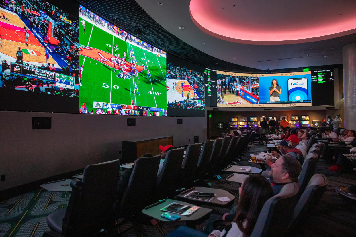 OXON HILL, MD - JANUARY 23: People watch sporting events at BetMGM Sportsbook & Lounge at MGM National Harbor in Oxon Hill, Maryland, on Sunday, January 23, 2022. (Amanda Andrade-Rhoades/For The Washington Post via Getty Images)