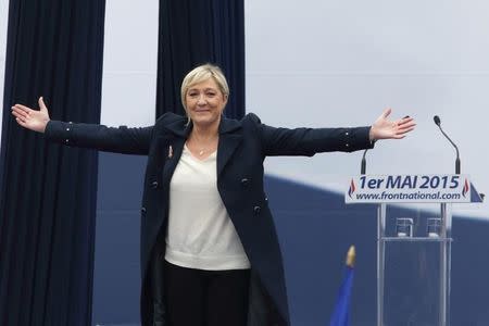 France's far-right National Front political party leader Marine Le Pen reaacts to the crowd at the begining of her speech during their traditional May Day tribute to Joan of Arc in Paris, France, May 1, 2015. REUTERS/Philippe Wojazer