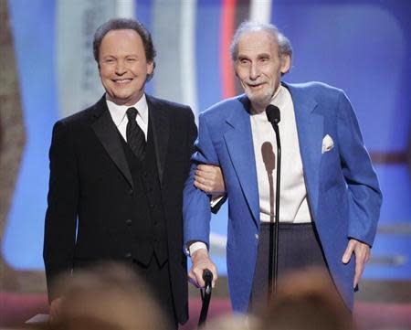 Legendary comedian Sid Caesar (R) accepts the TV Land Pioneer award presented by friend and comedian Billy Crystal (L) during a taping of the TV Land awards show March 19, 2006 in Santa Monica, California. REUTERS/Fred Prouser
