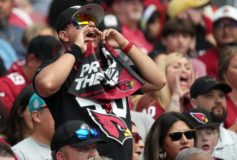 Oct 8, 2023; Glendale, Arizona, United States; Fans cheer from the stands as the Arizona Cardinals take on the Cincinnati Bengals at State Farm Stadium.