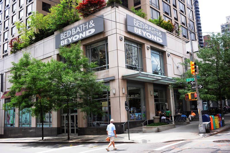 FILE PHOTO: A passerby walks in front of a Bed, Bath, and Beyond in New York