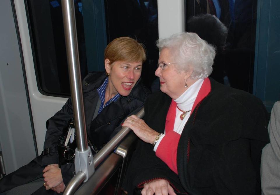 Deborah Ross and Wake County Commissioner Betty Lou Ward talk while riding a light rail train in Charlotte in this 2008 file photo. Ward passed away on Nov. 8, 2023