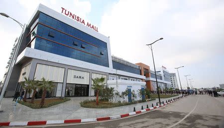 People wait in line to enter the Tunisia Mall in Berges du Lac in Tunis, Tunisia, December 20, 2015. REUTERS/Zoubeir Souissi