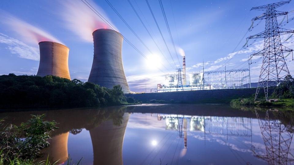 A nuclear power plant in a field.