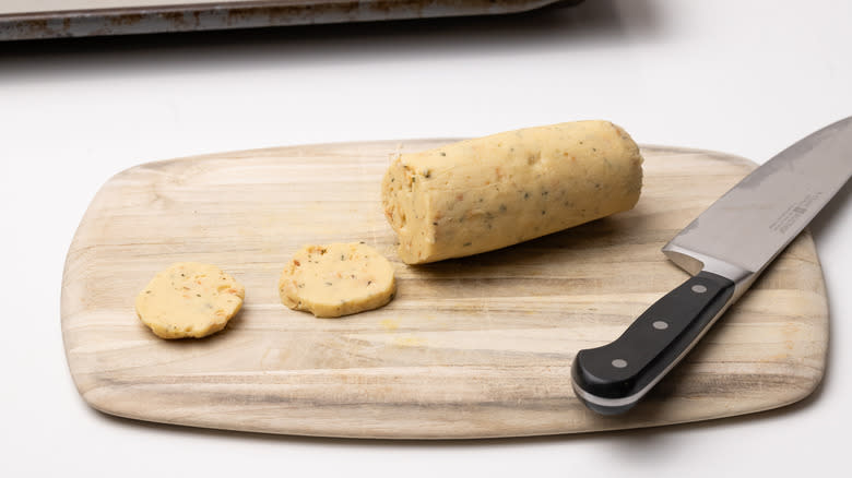 slicing chilled shortbread dough next to knife