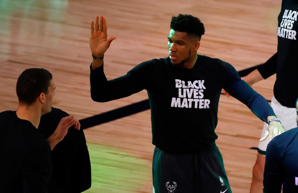 Giannis Antetokounmpo is introduced before the game. It was the first NBA playoff game after the players did not play for three days, while protesting social injustice