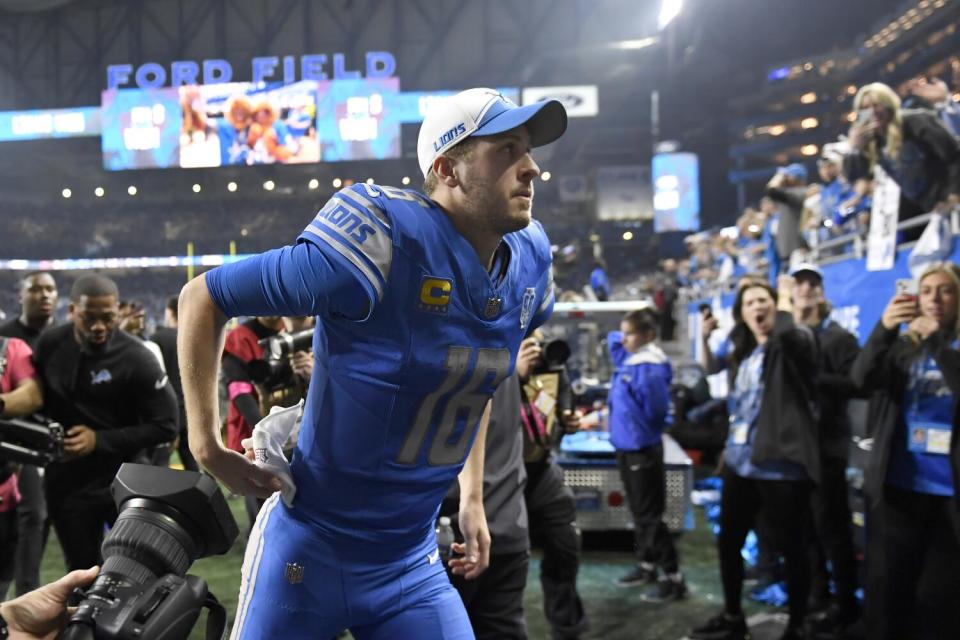 Lions quarterback Jared Goff runs off the field after beating the Buccaneers in the NFL playoffs.