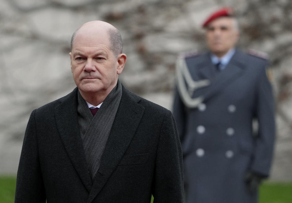 German Chancellor Olaf Scholz waits for Ireland's Prime Minister Micheal Martin at the chancellery in Berlin, Germany, Tuesday, Feb. 22, 2022. (AP Photo/Michael Sohn)