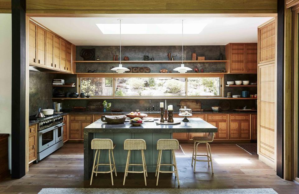 kitchen with green island and limestone countertops