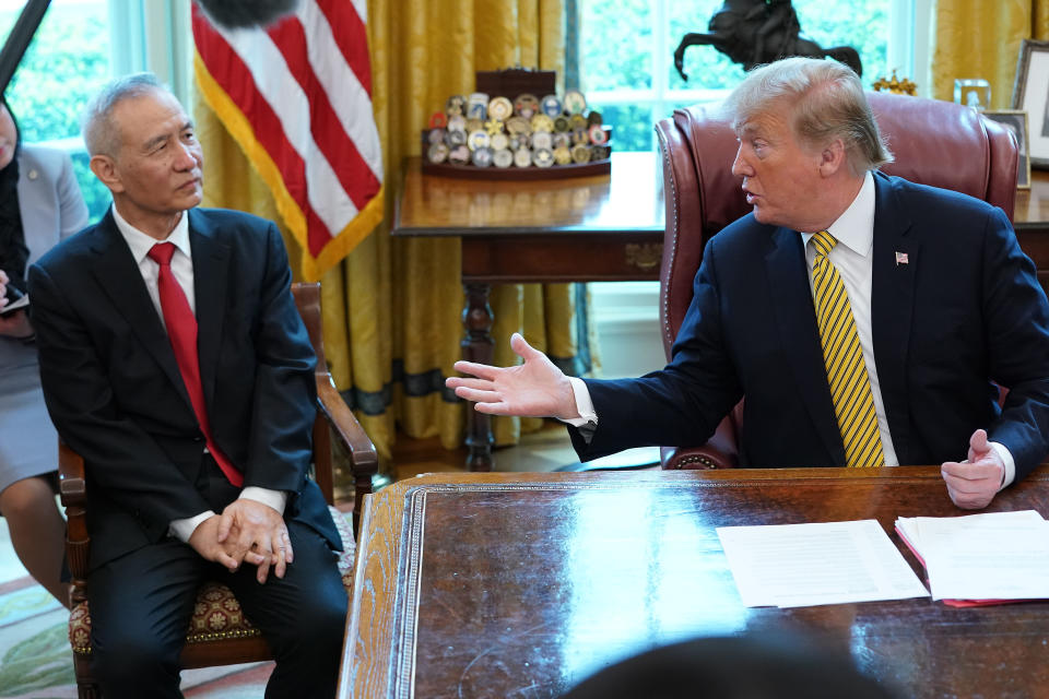 WASHINGTON, DC - APRIL 04: U.S. President Donald Trump (R) and Chinese Vice Premier Liu He talk to reporters in the Oval Office at the White House April 04, 2019 in Washington, DC. The New York Times reported Thursday that Trump is likely to announce plans for a future summit meeting with Chinese President Xi Jinping to resolve remaining trade issues and sign a final agreement between the U.S. and China. (Photo by Chip Somodevilla/Getty Images)