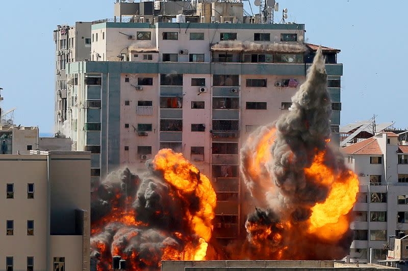 FILE PHOTO: A tower housing AP, Al Jazeera offices collapses after Israeli missile strikes in Gaza city