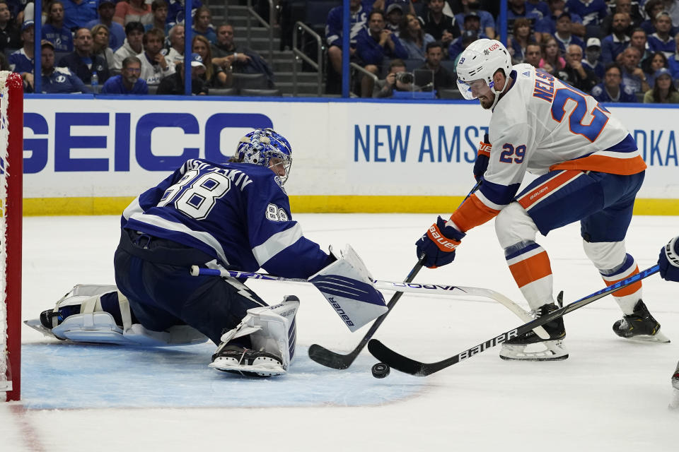 Tampa Bay Lightning goaltender Andrei Vasilevskiy (88) tracks a shot by New York Islanders center Brock Nelson (29) during the third period in Game 2 of an NHL hockey Stanley Cup semifinal playoff series Tuesday, June 15, 2021, in Tampa, Fla. (AP Photo/Chris O'Meara)