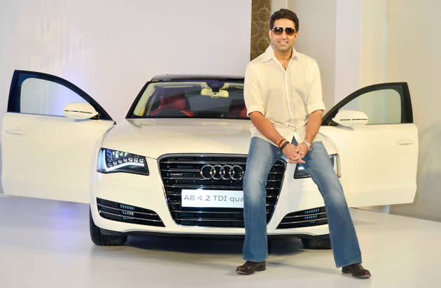 Abhishek Bachchan poses with his new Audi A 8. There were rumours that he had booked it for his baby Aaradhya. This Rs 1.07 crore beauty was customized especially for Bachchan Jr.