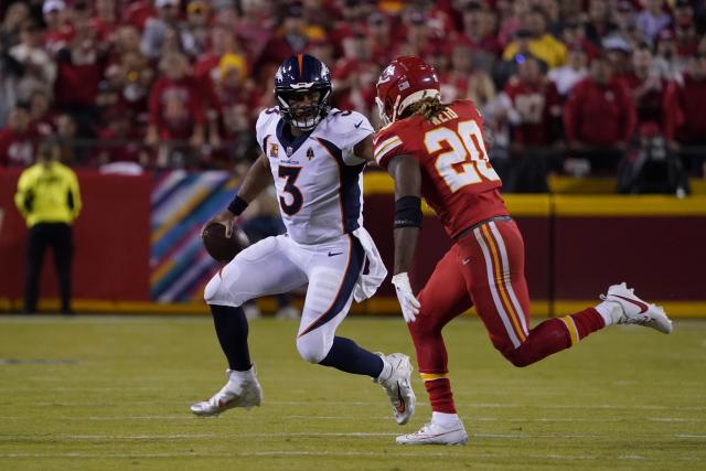 DENVER, CO - DECEMBER 11: Denver Broncos quarterback Russell Wilson (3)  scrampes out of the pocket in the first quarter during a game between the  Kansas City Chiefs and the Denver Broncos