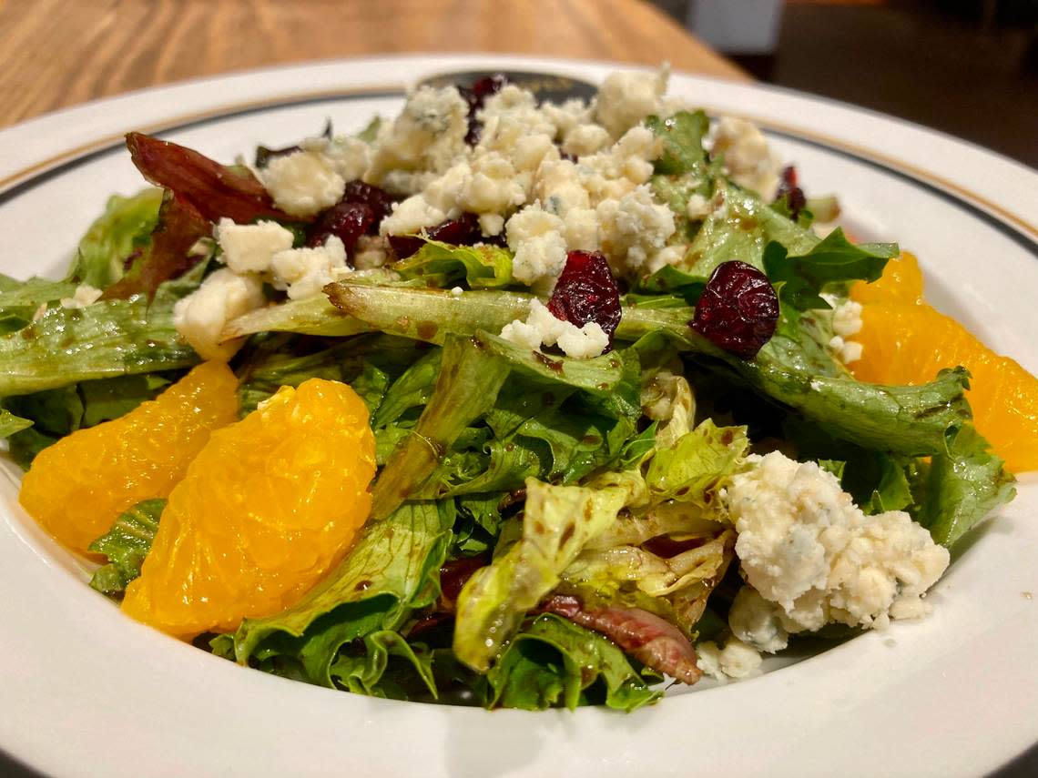 ‘Orleans salad of mixed greens, mandarin oranges, dried cranberries, candied pecans and crumbled blue cheese tossed in balsamic dressing at ‘Orleans on Carroll Street in downtown Perry.