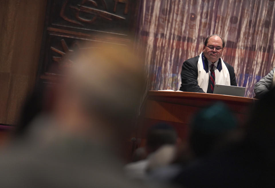 Rabbi Daniel Fellman leads Shabbat service Friday, Oct. 13, 2023, at Temple Sinai in Pittsburgh. The congregation prayed for the safety of the state of Israel, for peace, and said a memorial prayer for those killed and missing after Hamas' attack. (AP Photo/Jessie Wardarski)