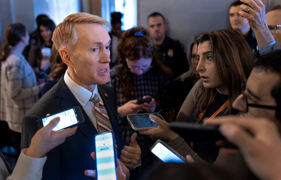 Sen. James Lankford, R-Okla., the lead GOP negotiator on a border-foreign aid package, speaks with reporters Jan. 25 outside the chamber at the Capitol in Washington. Any bipartisan border deal could be doomed because of resistance from former President Donald Trump.