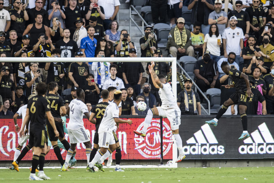 Los Angeles FC midfielder José Cifuentes, right, scores a goal during the first half of an MLS soccer match against the LA Galaxy in Los Angeles, Friday, July 8, 2022. (AP Photo/Kyusung Gong)