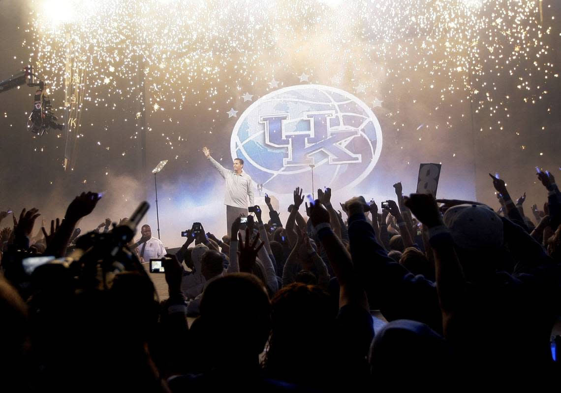 UK coach John Calipari saluted the fans as fireworks rained down at Rupp Arena during Big Blue Madness festivities on Oct. 16, 2009. Mark Cornelison/2009 staff file photo