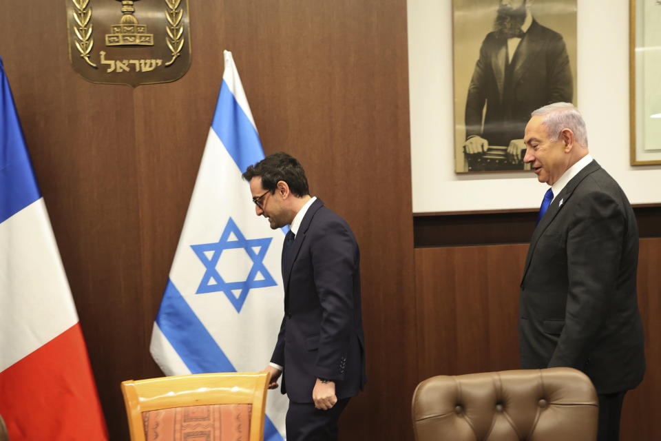 Israeli Prime Minister Benjamin Netanyahu, right, and France's Foreign Minister Stephane Sejourne during their meeting in Jerusalem Monday, Feb. 5, 2024. 5, 2024. (Gil Cohen-Magen/Pool via AP)