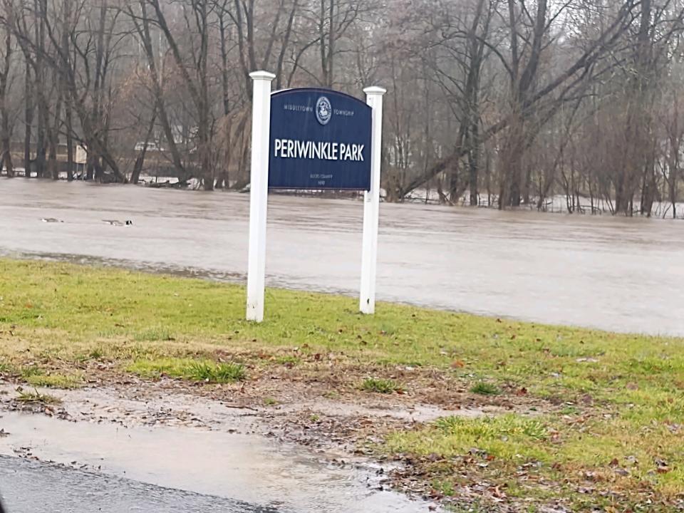 The Neshaminy Creek spills it banks near Periwinkle Park in Middletown and impacts parts of Neshaminy Woods in Lower Southampton. Some streets in the community were under water Monday afternoon.