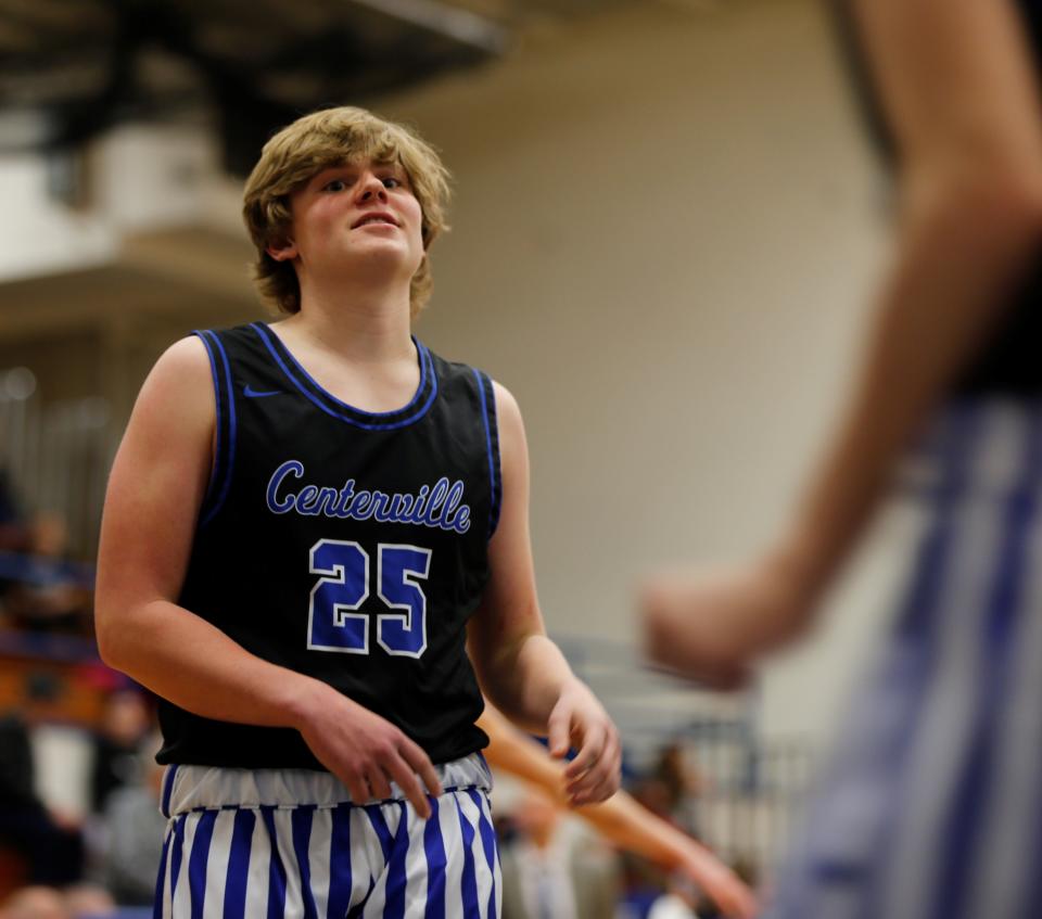 Centerville freshman Chase Clark goes through the layup line during warmups before a game against Tri Feb. 18, 2022.