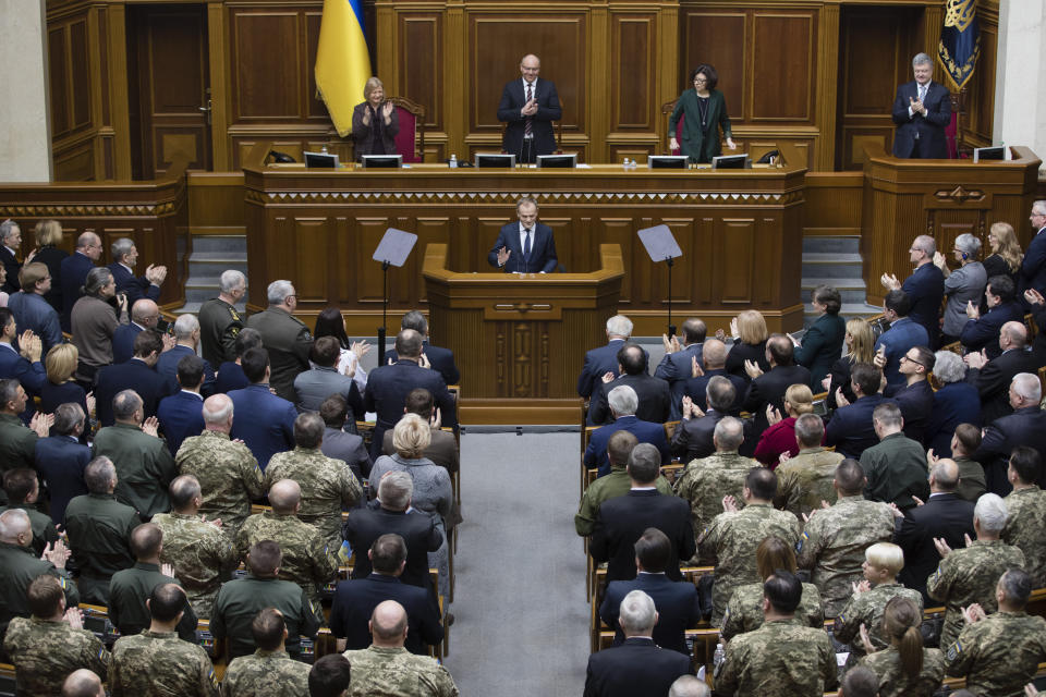 European Council President Donald Tusk, center, address to Ukrainian parliament in Kiev, Ukraine, Monday Feb. 19, 2019. (Mikhail Palinchak, Presidential Press Service Pool Photo via AP)