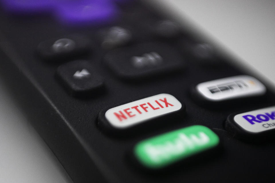 A Roku remote with a Netflix button. - Credit: AP Photo/Jenny Kane