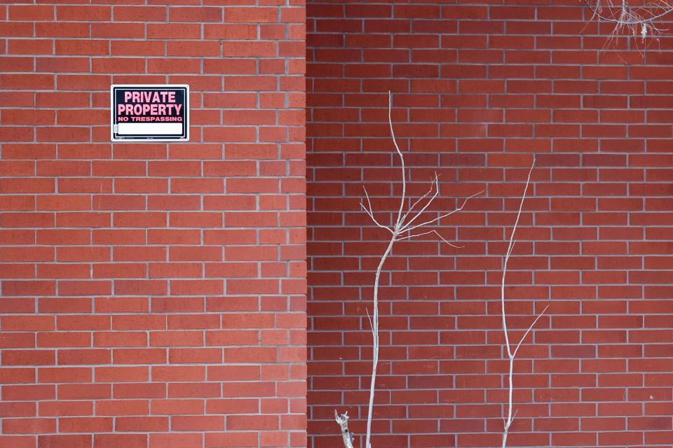 A sign warns against trespassing March 6 at the New Life Village at 1300 E Ayers in Edmond.